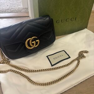 Used like new Gucci GG Marmont Matelasse Leather Black Super Mini Bag.